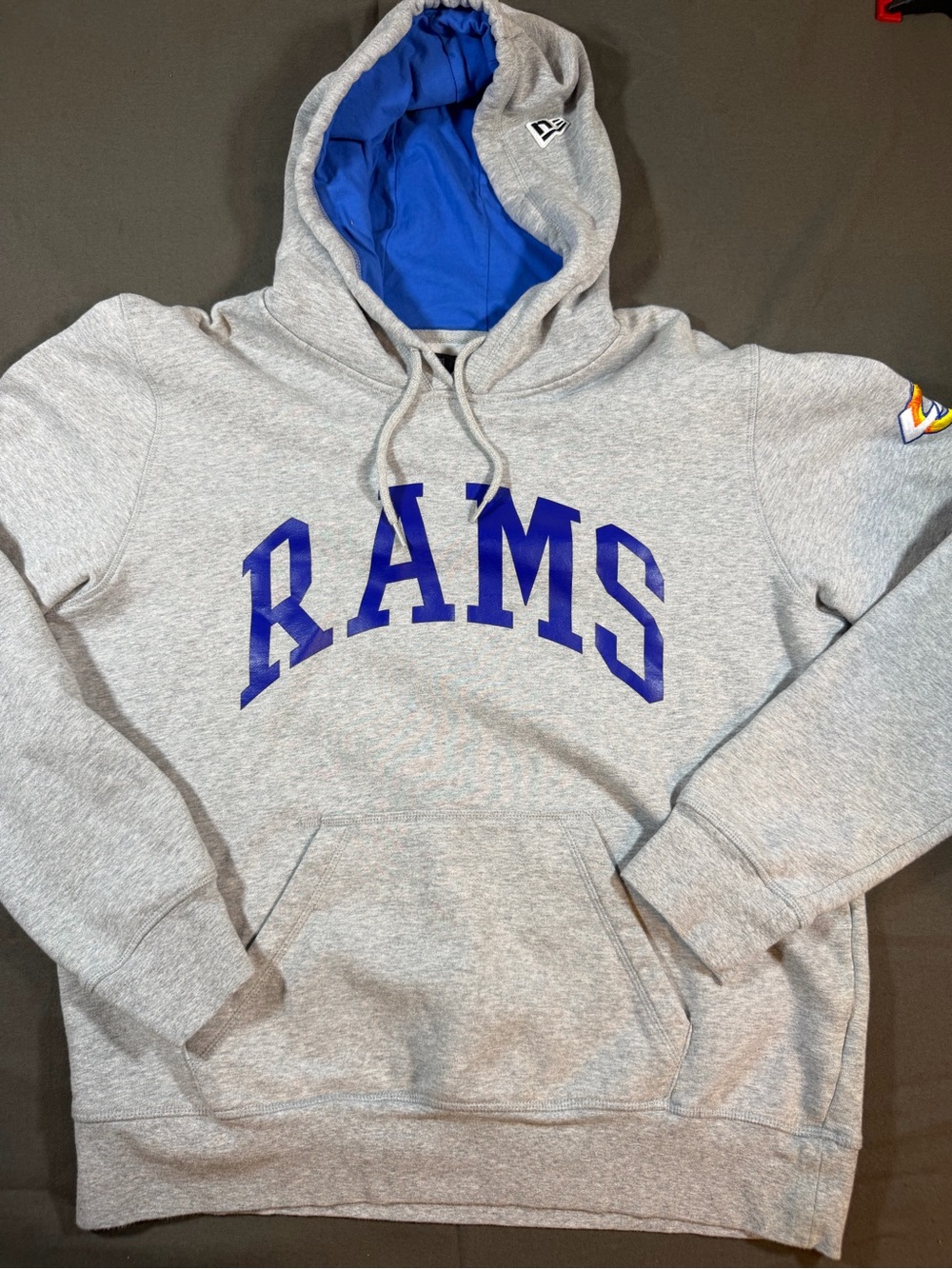 NFL L.A. Rams New Era Gray Hoodie with 'RAMS' text and logo on right shoulder